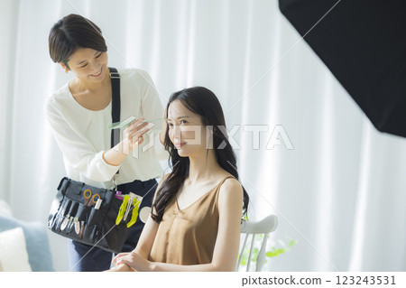 Photographer, model, hair and makeup photoshoot Photographer, model, hair and makeup photoshoot 123243531