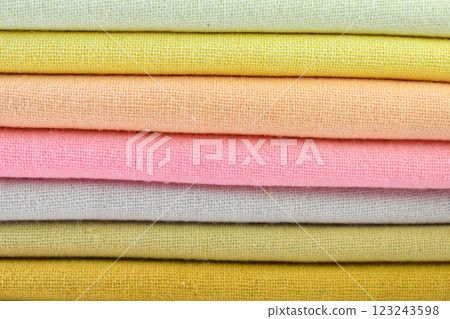 stack of colourful cotton clothes, close up pile of clothing 123243598