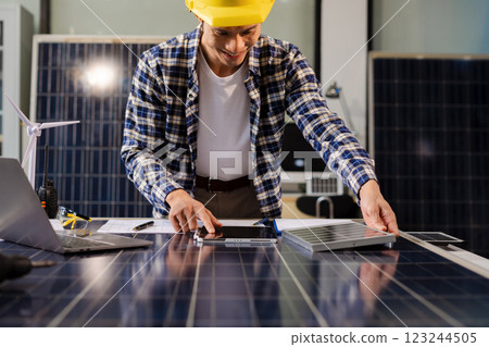 Engineer, blueprint and site building job for architect, builder and engineer sketching a construction project, green energy and solar panel concept. 123244505