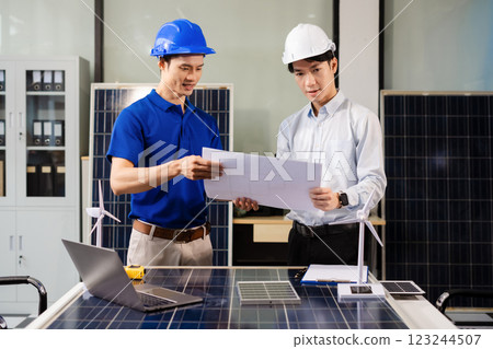 Architect team of Specialists use laptop computer on Construction Site, construction project, Businessman and worker discussing blueprint plan Architect team of Specialists use laptop computer on Construction Site, construction project, Businessman and worker discussing blueprint plan 123244507