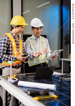 Construction team, blueprint and site building job for architect, builder and engineer sketching a construction project, green energy and solar panel concept Construction team, blueprint and site building job for architect, builder and engineer sketching a construction project, green energy and solar panel concept 123244526