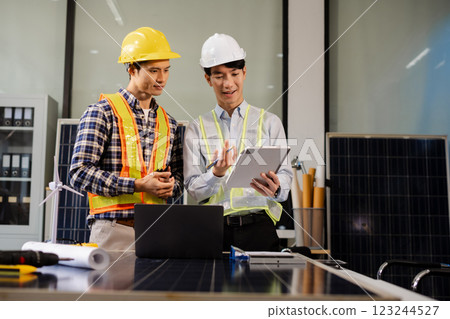 Construction team, blueprint and site building job for architect, builder and engineer sketching a construction project, green energy and solar panel concept Construction team, blueprint and site building job for architect, builder and engineer sketching a construction project, green energy and solar panel concept 123244527