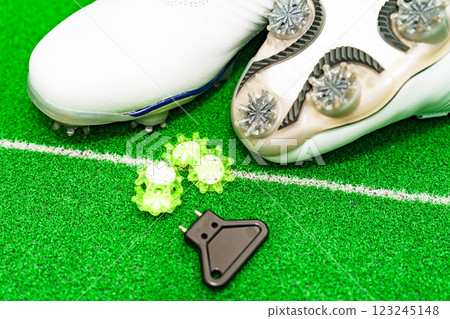 Golf shoes, spikes and a spike wrench [Golf equipment image] 123245148
