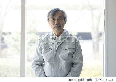 Senior man in work clothes Senior man in work clothes 123245795
