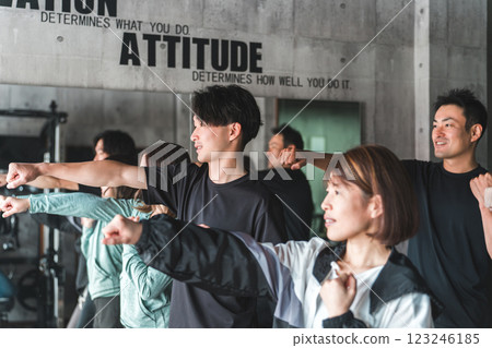 Men and women learning boxercise, dance, exercise, karate, muay thai at the gym 123246185