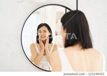 A woman satisfied with her skin tone A woman satisfied with her skin tone 123246401
