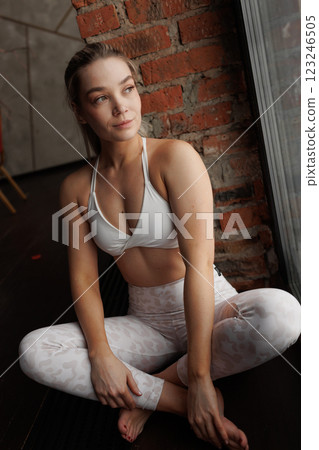 Slender girl in sportswear doing physical exercises. healthy lifestyle. 123246505