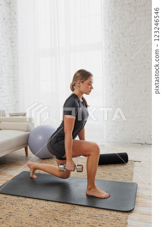 young girl doing home fitness, home workouts 123246546