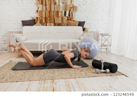 young girl doing home fitness, home workouts young girl doing home fitness, home workouts 123246549