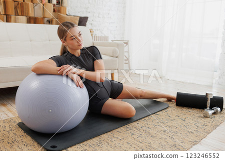 young girl doing home fitness, home workouts 123246552