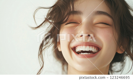 Radiant joy captured in a smiling face, the warmth of happiness beaming from every feature with flowing hair on a light background. Radiant joy captured in a smiling face, the warmth of happiness beaming from every feature with flowing hair on a light background. 123246695