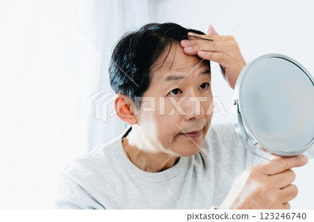 Middle-aged man who cares about hair 123246740