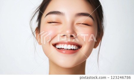 Radiant smile on fair skin, eyes closed, showcasing healthy teeth. Pure joy and self-care. Enhancing natural beauty with cosmetic procedures. Radiant smile on fair skin, eyes closed, showcasing healthy teeth. Pure joy and self-care. Enhancing natural beauty with cosmetic procedures. 123246786