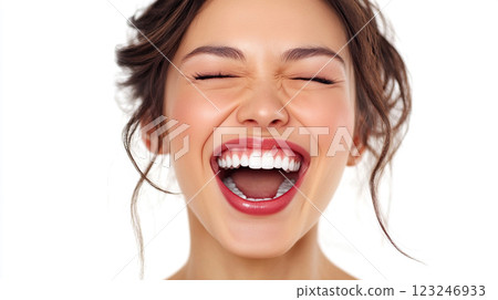 Radiant Joy: A woman's genuine smile showcases bright, white teeth against a clean backdrop, radiating happiness and confidence. Radiant Joy: A woman's genuine smile showcases bright, white teeth against a clean backdrop, radiating happiness and confidence. 123246933