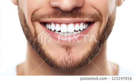 Radiant Smile: Close-up of a man with healthy, perfectly aligned white teeth. He has well-groomed facial hair and a confident expression. 123247058