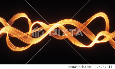 Abstract waves of light painting create dynamic flowing patterns. The golden light undulates against a stark black background in this artwork. Abstract waves of light painting create dynamic flowing patterns. The golden light undulates against a stark black background in this artwork. 123247211