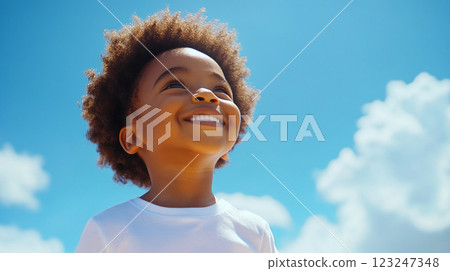 A happy child smiles up at the sunny blue sky, filled with puffy white clouds, radiating joy and innocence on a beautiful bright day. A happy child smiles up at the sunny blue sky, filled with puffy white clouds, radiating joy and innocence on a beautiful bright day. 123247348