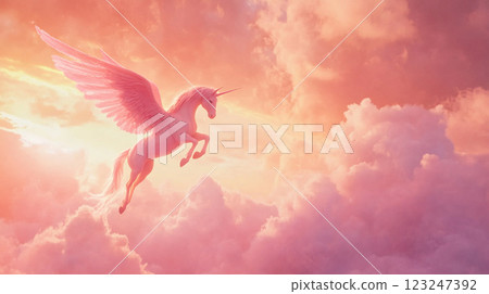 A majestic winged unicorn soars through a dreamy, cloud-filled sky, bathed in soft pink and gold light. Magical and ethereal beauty. 123247392