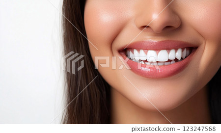 A close-up showcases a radiant smile with healthy teeth. The image emphasizes dental care and a confident expression. A close-up showcases a radiant smile with healthy teeth. The image emphasizes dental care and a confident expression. 123247568