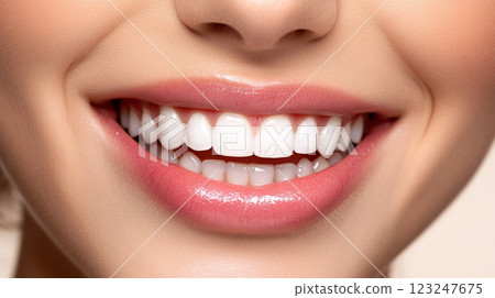 A close-up of a bright, confident smile with healthy teeth and pink lips creates a warm and inviting aesthetic. 123247675