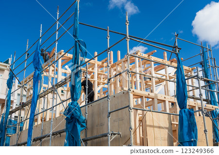 Building up a two-story wooden house 123249366