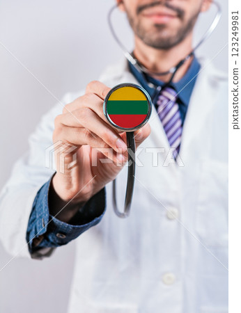 Lithuania health and medical insurance concept. Lithuania healthcare system, doctor holding stethoscope Lithuania health and medical insurance concept. Lithuania healthcare system, doctor holding stethoscope 123249981