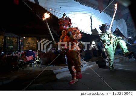 Masuiyama Zuigan Demon-Exorcism Ceremony: Red and blue demons dancing with torches in the dark Masuiyama Zuigan Demon-Exorcism Ceremony: Red and blue demons dancing with torches in the dark 123250045