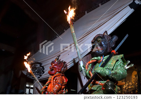 Demon-chasing ceremony at Masui-san Zuiganji Temple: Red and blue demons dancing with torches in the dark 123250193