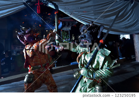 Demon-chasing ceremony at Masui-san Zuiganji Temple: Red and blue demons slamming torches into the darkness 123250195