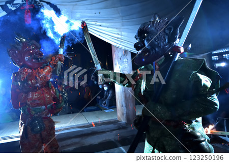 Demon-chasing ceremony at Zuiganji Temple: Red and blue demons slamming torches into the darkness 123250196