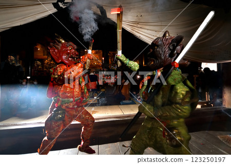 Demon-chasing ceremony at Zuiganji Temple: Red and blue demons slamming torches into the darkness 123250197