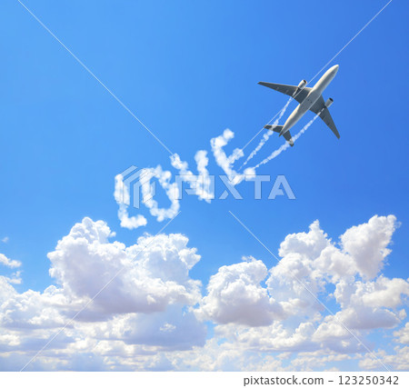 Blue sky with aircraft and Jet trailing smoke. Airplane drawing a word love in sky. Concept of love of travelling. Topic of summer vacation, travel, trip abroad on vacation, cruises and tours 123250342