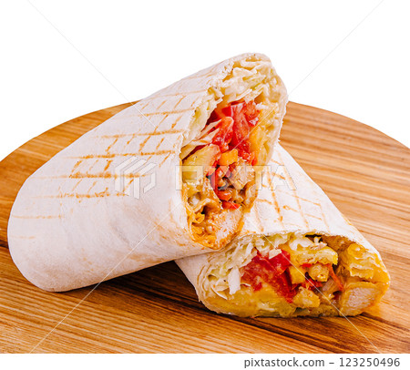 Delicious grilled wrap filled with fresh vegetables and meat Delicious grilled wrap filled with fresh vegetables and meat 123250496