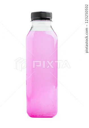 Clear bottle filled with vibrant pink liquid on a white background 123250502