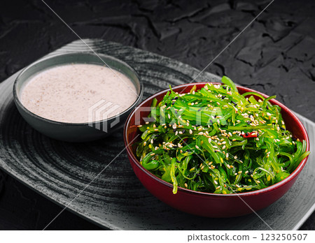 Fresh seaweed salad with a creamy sesame dressing on display Fresh seaweed salad with a creamy sesame dressing on display 123250507