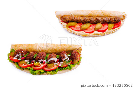 Delicious falafel and kebab wraps with fresh vegetables 123250562