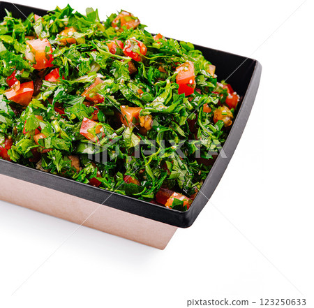 Freshly prepared tabbouleh salad with vibrant herbs and vegetables 123250633