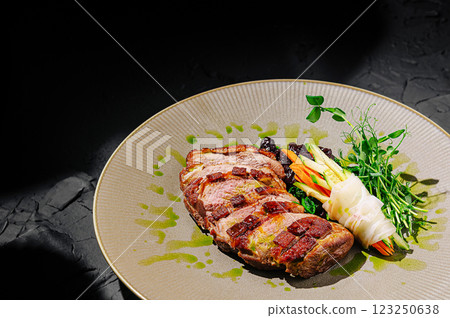 Delicious grilled steak served with fresh vegetables on a plate 123250638