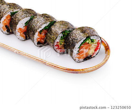 Fresh sushi rolls with salmon and vegetables on a plate 123250650