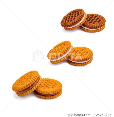 Delightful orange cream-filled cookies stacked for a tasty treat 123250707