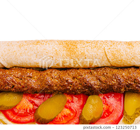 Delicious kebab wrap with fresh vegetables and sauces 123250713