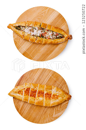 Delicious traditional breads served on wooden boards with toppings Delicious traditional breads served on wooden boards with toppings 123250722
