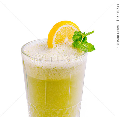 Refreshing lemon and mint beverage served in a glass Refreshing lemon and mint beverage served in a glass 123250734