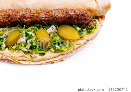 Delicious wrap with grilled meat and fresh vegetables Delicious wrap with grilled meat and fresh vegetables 123250741