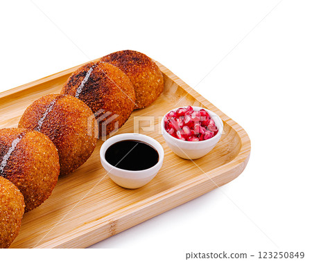 Delightful Indian snacks served on a wooden platter 123250849