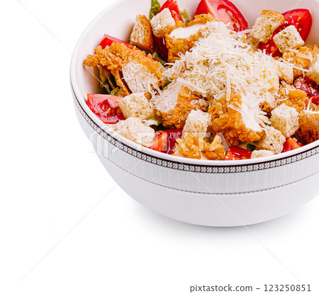 Fresh salad with crispy chicken and parmesan served in bowl 123250851