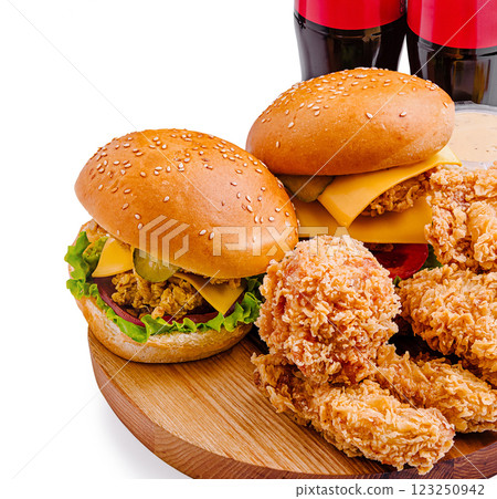 Delicious fast food spread with burgers and fried chicken 123250942