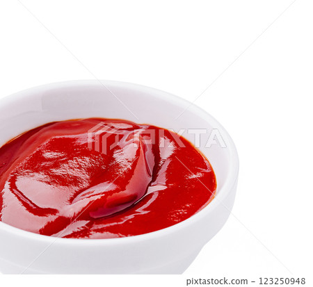 Red condiment in a white bowl perfect for dipping and seasoning 123250948
