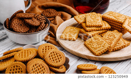 Variety of cookies arranged on wooden table with tea 123250949