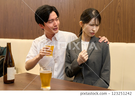 A drunk man drinking heavily 123251242